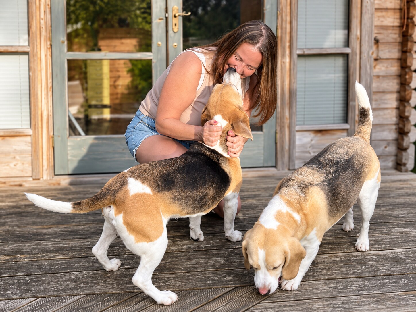 Sharon relaxing in the garden with her two beagles